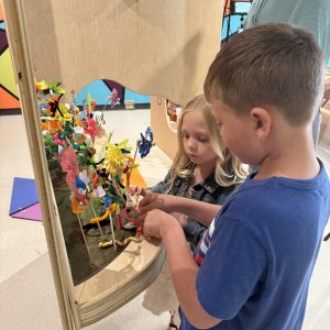 Two children playing in Art Park.