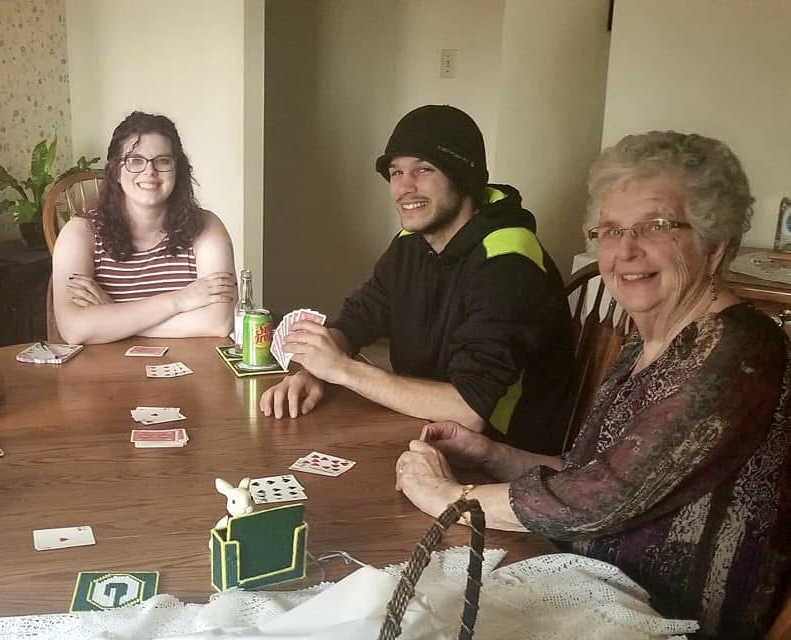 A rousing game of rummy played during a family celebration with Emily Wesenick, her husband, and her grandma.