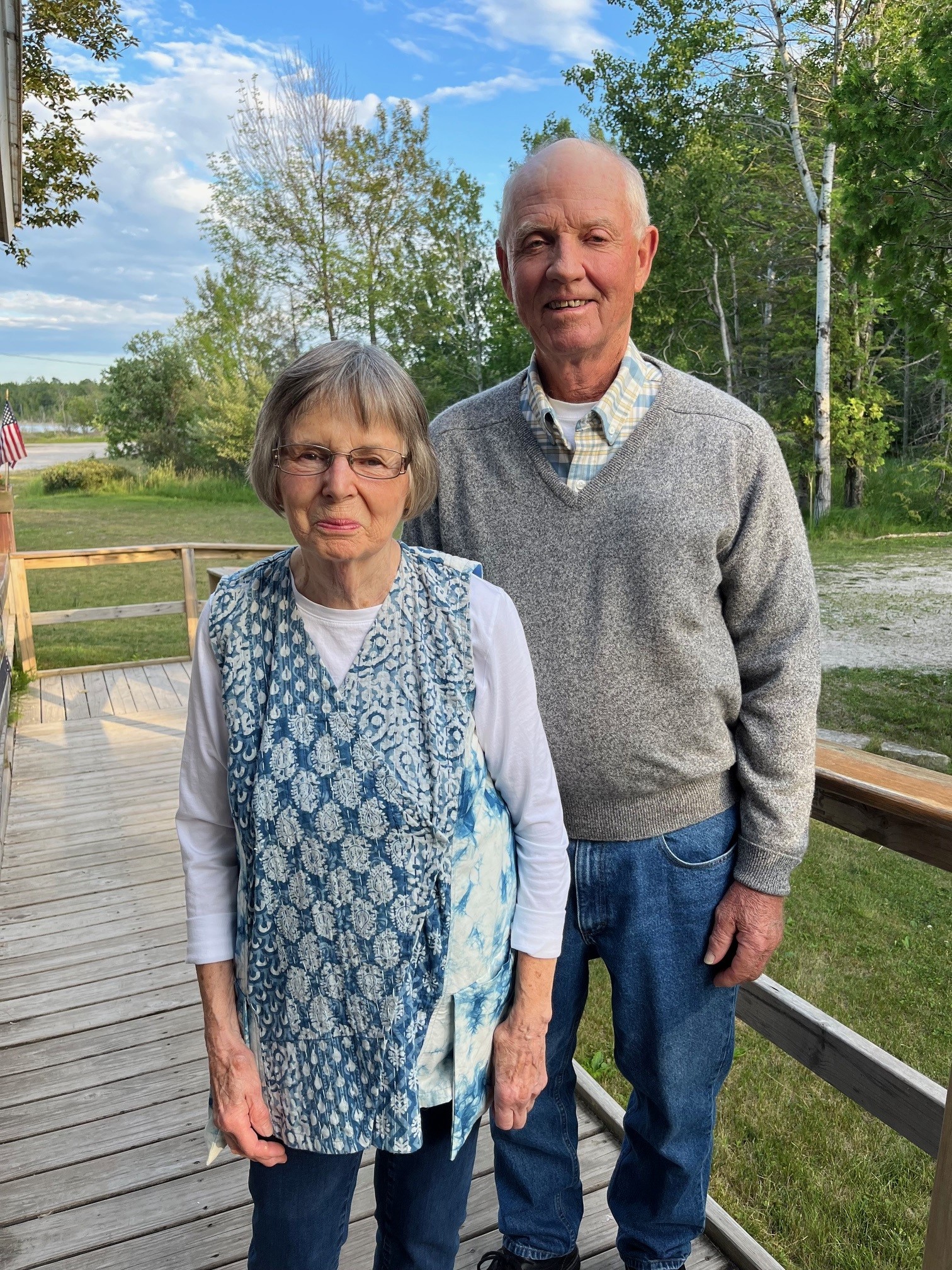 This image shows a woman and a man together smiling for the camera