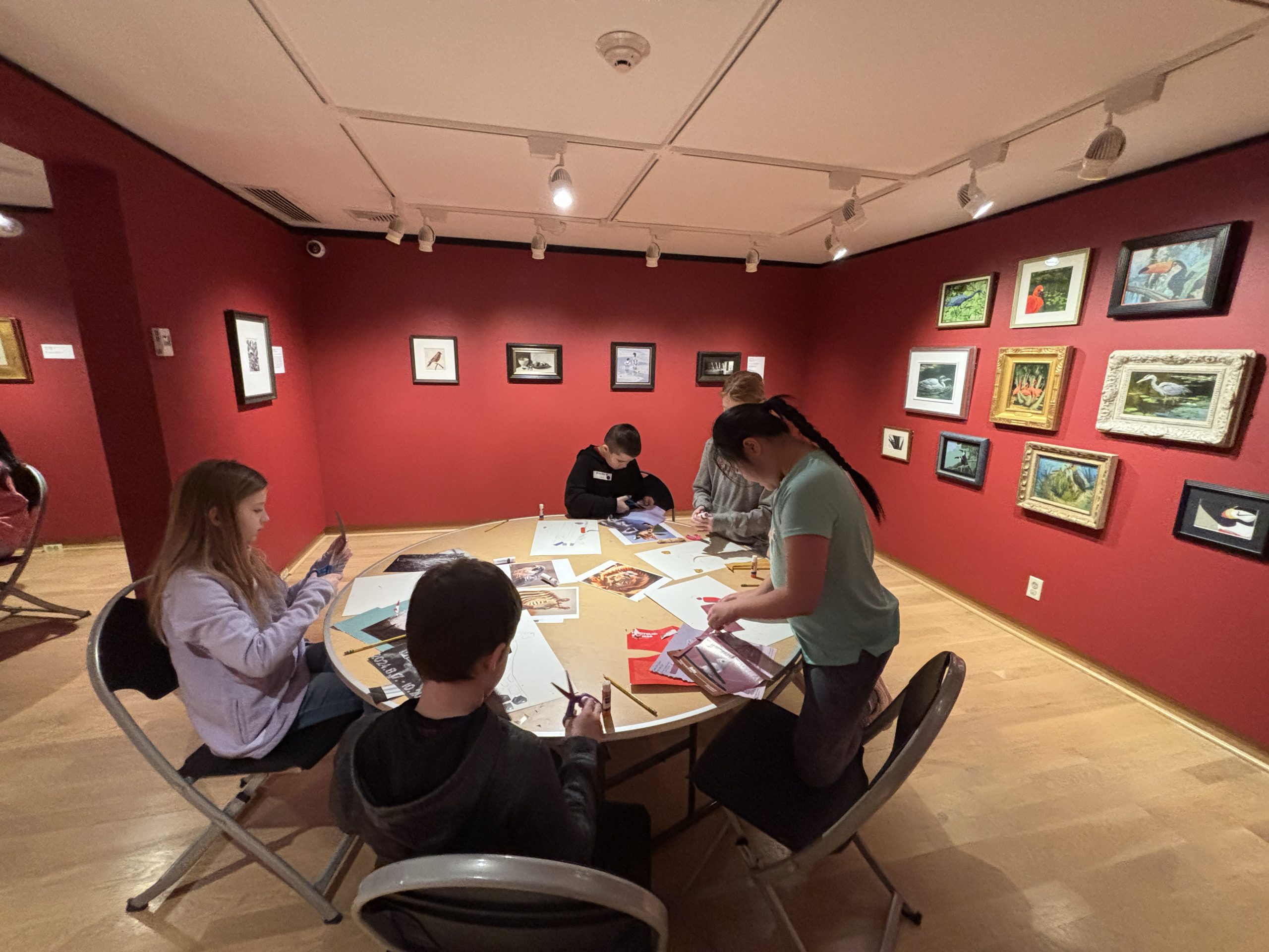 Fourth grade students creating colorful painted-paper collages in the Museum's south gallery.