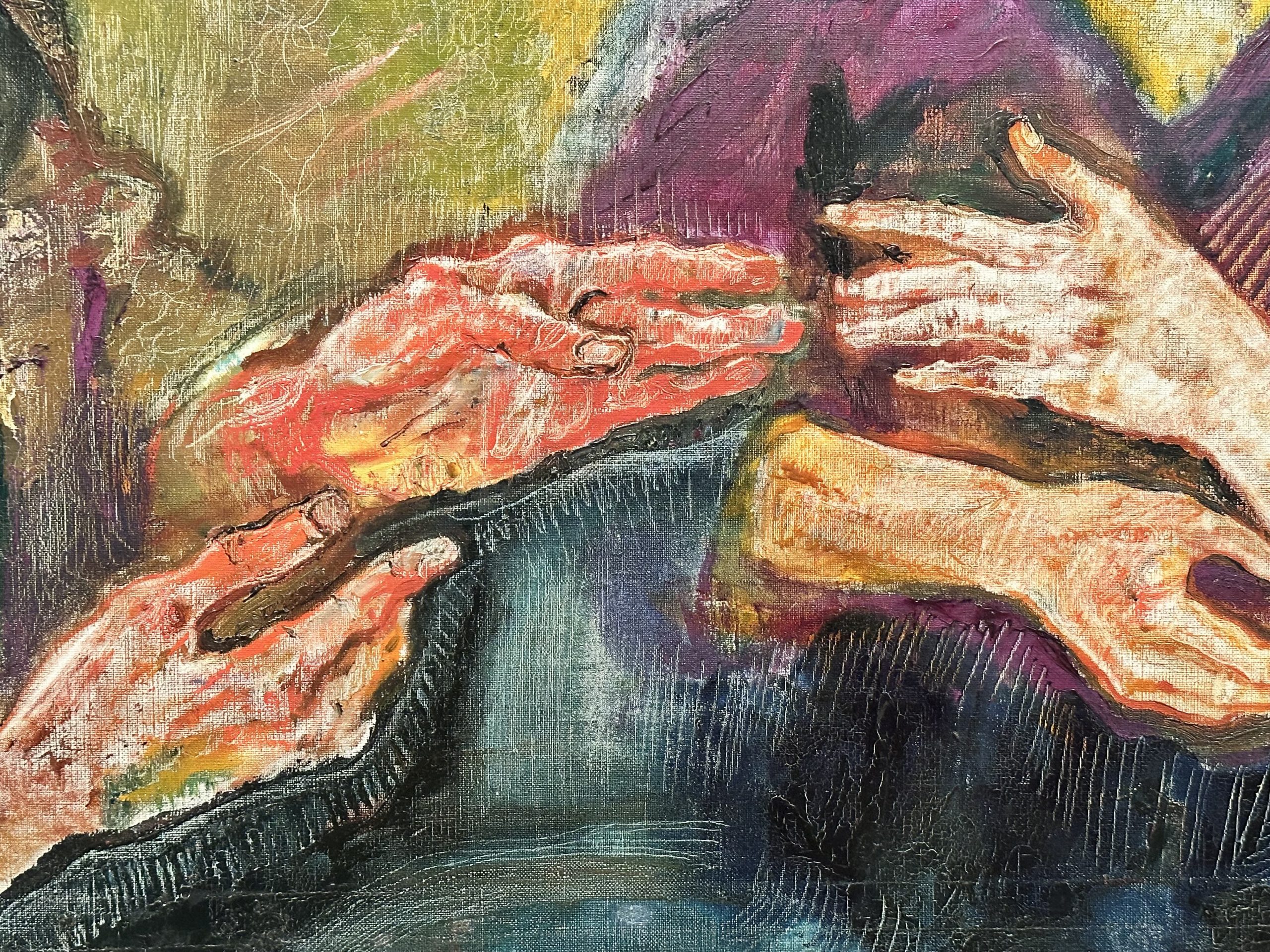 A close up of two pairs of hands in a painting.