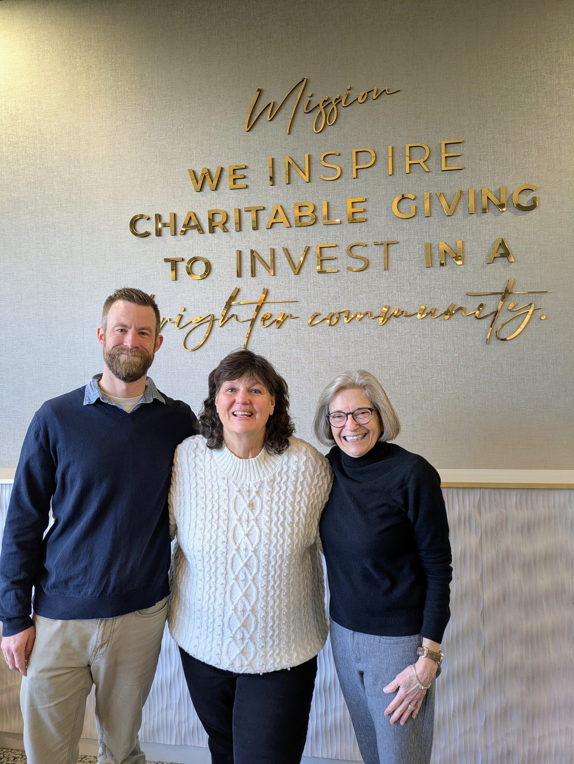 This image shows Matt Foss (left), Sue Nelson (center), and Kathy Foley (right) together at Sue's retirement party.